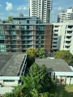 a view of a city with tall buildings and trees at Apartment in Central Sukhumvit in Bangkok