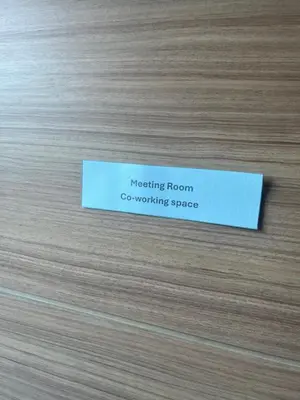 a piece of paper on a wooden surface at Apartment in Central Sukhumvit in Bangkok