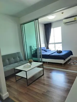 a living room with a bed and a mirror at Cozy Apartment Night Market and Shopping Mall at MRT Purple Line in Nonthaburi