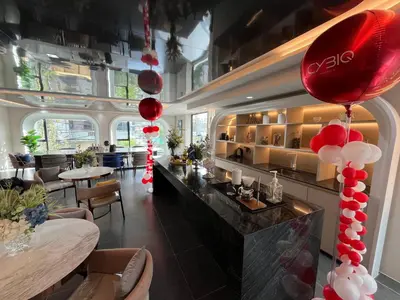 a restaurant with red and white balloons hanging from the ceiling at Cybiq Ratchada 32 By OBM in Ban Zong Katiam