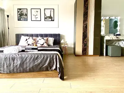 a bedroom with a bed in a room at Impact Arena C75fl by GoodRoom24 in Ban Song Hong