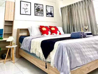 a bedroom with a large bed with red pillows at Impact Arena Condo C7 fl12 By GoodRoom24 in Ban Song Hong