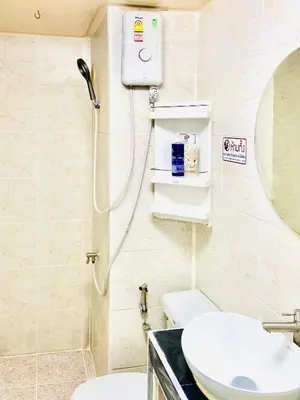 a bathroom with a shower and a toilet and a sink at Impact Arena Condo C7 fl12 By GoodRoom24 in Ban Song Hong