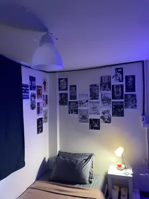 a bedroom with a bed and a purple light at Best Stay 394 homestay in Phra Khanong