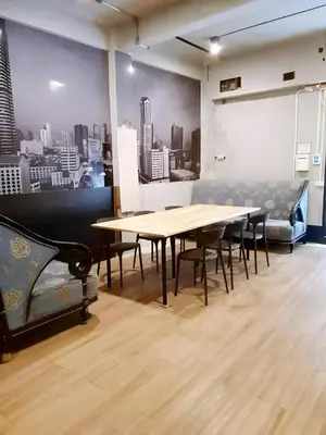 a conference room with a table and chairs at XX GO INN BTS Silom - Saint Louis สถานีรถไฟฟ้าเซนต์หลุยส์ in Bangkok