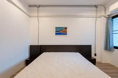 a bedroom with a bed in a room at Silom Condominium in Bang Rak