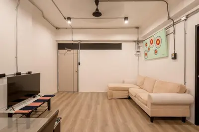 a living room with a couch and a tv at Silom Condominium in Bang Rak