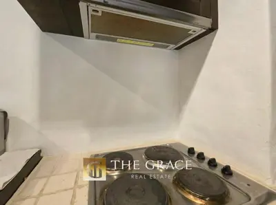 a kitchen with a stove top in a room at Beach front in Hua Hin Khao Tao in Ban O Pao