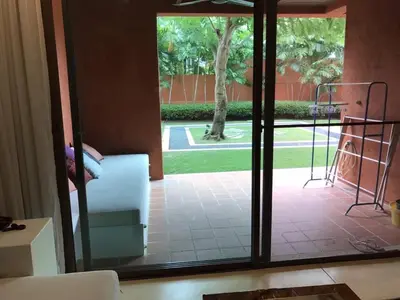 a view of a room with a sliding glass door at Beach front in Hua Hin Khao Tao in Ban O Pao