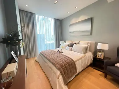 a bedroom with a large bed and a couch at Luxury Apartment Best Location Silom in Bangkok