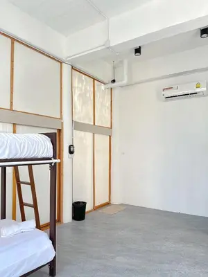 a room with two bunk beds in it at Shared Room Megun in Ban Bang Phlat