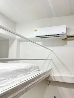 a hospital bed with a light on the ceiling at Megun Room5 in Ban Bang Phlat