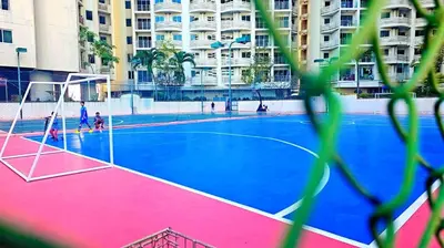 an empty basketball court in front of a building at River View Active 3 in Bangkok