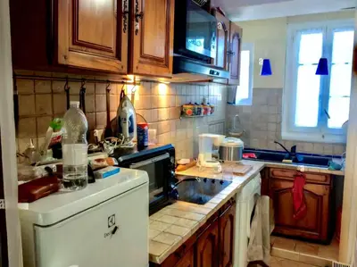 a kitchen with a sink and a stove top oven at River View Active 3 in Bangkok