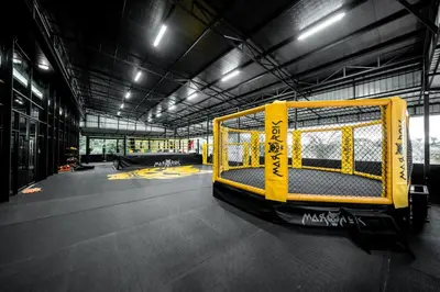a gym with a yellow cage in a building at River View Active 3 in Bangkok
