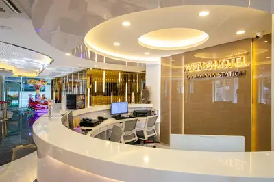 a lobby of a medical office with a desk and chairs at Airbus Hotel At Phawana Station in Bangkok
