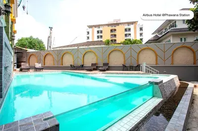 a large swimming pool on top of a building at Airbus Hotel At Phawana Station in Bangkok