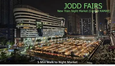 a large building with a lot of cars in front of it at Near Big Jodd Fair Night Market and Shopping Mall in Bangkok