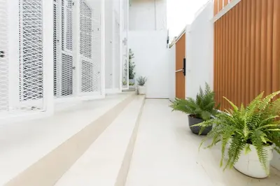 a corridor with plants in a building at Peaceful Townhouse in Sathorn Near Saint Louis BTS in Yan Nawa