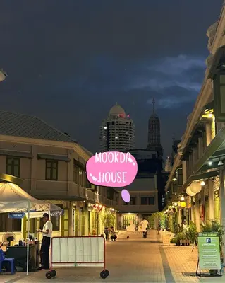 a sign for a mooch house on a city street at Mookda House Chinatown BKK near MRT Samyot in Khlong San