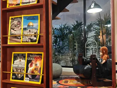 a room with two movie posters on a wall at Thonglor 4-story modern art villa Free WiFi Netflix in Bangkok