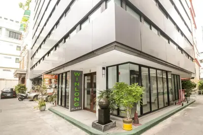 a store front of a building with windows at Premier Place Bangkok in Bangkok