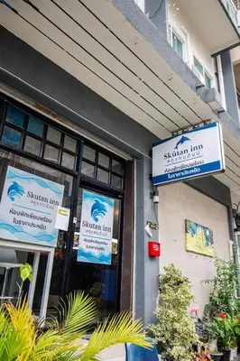 a building with signs on the front of a building at Skutan-MTB Bangchak in Bangkok