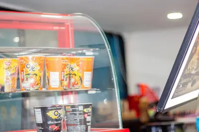 a display case in a store with some food at Skutan-MTB Bangchak in Bangkok