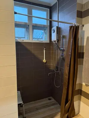 a bathroom with a shower with a window at Family home Don muang airport in Lak Si