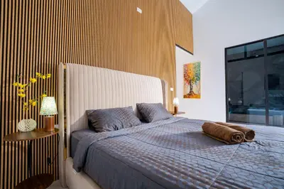 a bedroom with a bed and a large window at Bangkok Luxury Private Pool & Jacuzzi Villa , Daily Maid in Bang Bua Thong