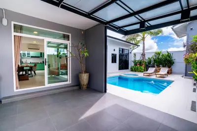 an image of a swimming pool in a house at Bangkok Luxury Private Pool & Jacuzzi Villa , Daily Maid in Bang Bua Thong