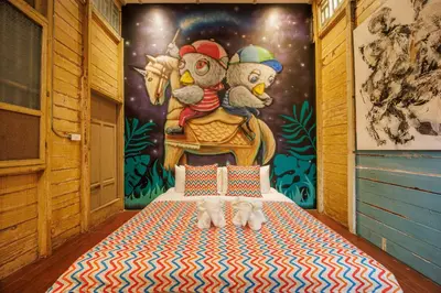 a room with a bed with three animals on it at The Anonymous House in Bangkok