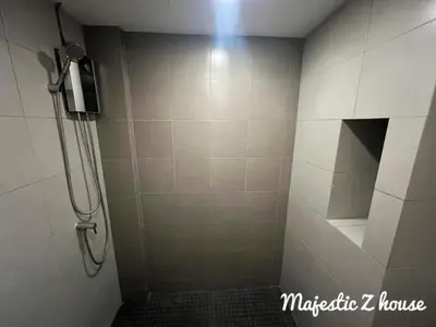 a bathroom with a shower stall with a shower at Z house Sukhumvit in Bangkok