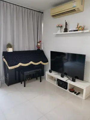 a living room with a table and a television at PERFECT 80sqm apartment serve up to 5 \u5b8c\u7f8e\u7684\u516c\u5bd3 in Bangkok