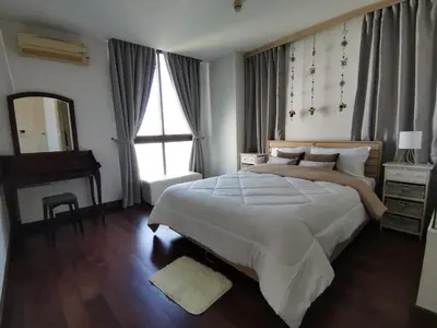 a bedroom with a large bed and a mirror at PERFECT 80sqm apartment serve up to 5 \u5b8c\u7f8e\u7684\u516c\u5bd3 in Bangkok