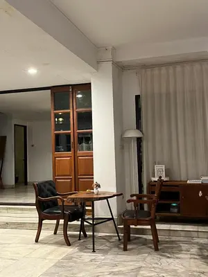 a living room with a table and two chairs at Hotel Nanon Sathorn in Bangkok