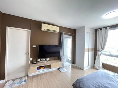a bedroom with a flat screen tv on a wall at Studio71 at changwattana in Ban Bang Phang