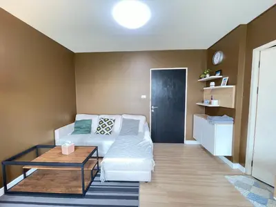 a living room with a couch and a coffee table at Studio71 at changwattana in Ban Bang Phang