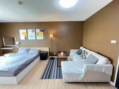 a living room with a bed and a couch at Studio71 at changwattana in Ban Bang Phang