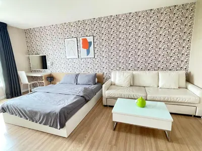 a living room with a bed and a couch at Studio117 at Changwattana in Ban Bang Phang
