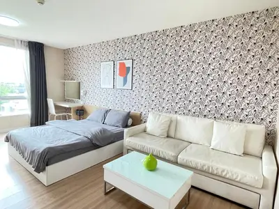 a living room with a bed and a couch at Studio117 at Changwattana in Ban Bang Phang