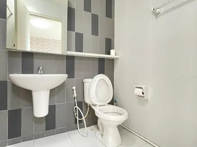 a bathroom with a toilet and a sink at Studio117 at Changwattana in Ban Bang Phang