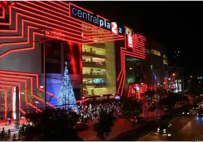 a city lit up at night with a christmas tree at Studio117 at Changwattana in Ban Bang Phang