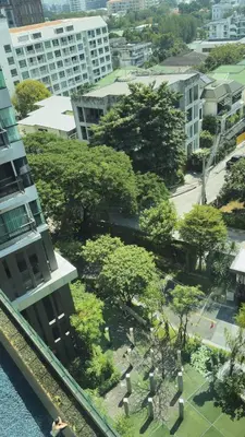 an aerial view of a park with trees and buildings at Luxurious Downtown Apartment With Train Access Bts in Bangkok