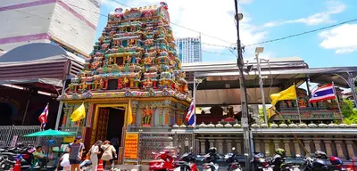 a large colorful tower in front of a building at XX GO INN Silom BTS Surasak - สุรศักดิ์ in Bangkok