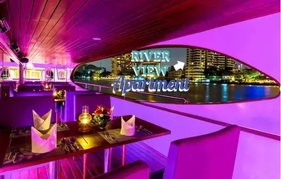 a purple room with a table and a neon sign at River View Active 6 in Bangkok