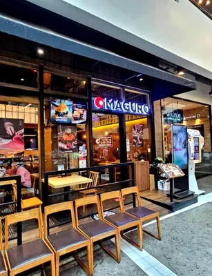 a restaurant with tables and benches in front of it at River View Active 6 in Bangkok