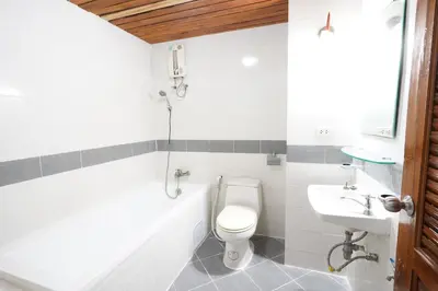 a bathroom with a toilet and a sink at Sathorn View in Bangkok