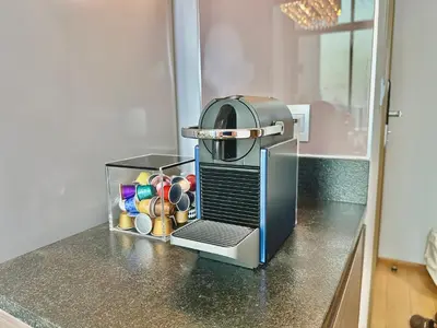 a toaster sitting on a kitchen counter next to a container at Luxury 2Bed Duplex - 1min From Thonglor BTS in Bangkok