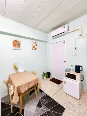 a small kitchen with a table and a stove at 201-STP Homely room Free Wi-Fi and Near BTS in Sathani Bang Khen